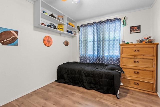 bedroom with hardwood / wood-style flooring