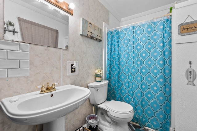 bathroom featuring sink and toilet