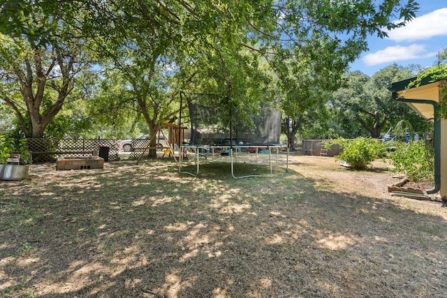 view of yard featuring a trampoline