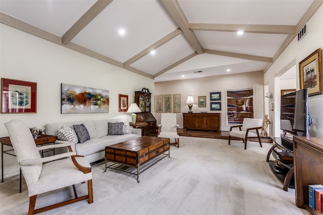 carpeted living room with lofted ceiling with beams