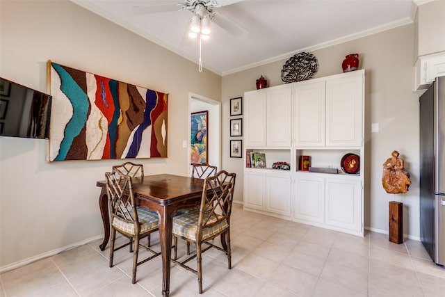 dining space with light tile patterned floors, ceiling fan, and crown molding