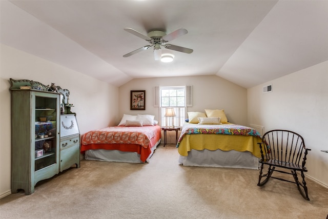 bedroom with ceiling fan, carpet flooring, and lofted ceiling