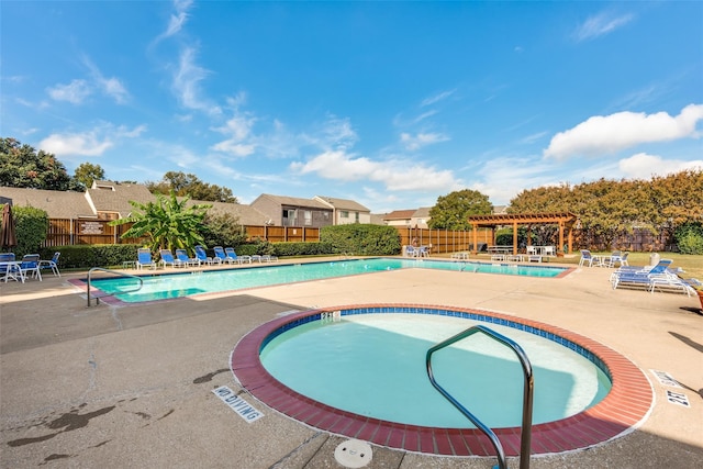 view of swimming pool featuring a patio area