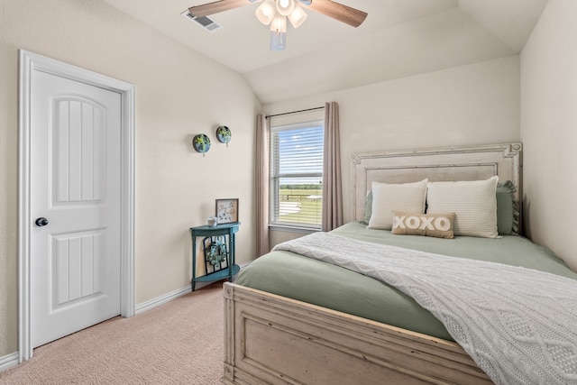 bedroom with light colored carpet, ceiling fan, and vaulted ceiling