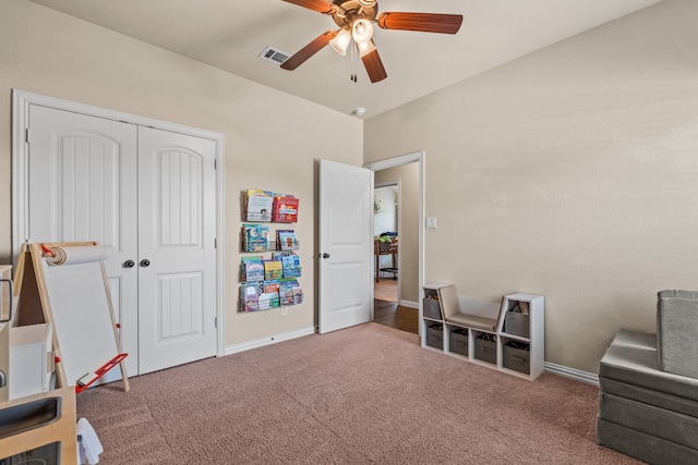 rec room with carpet floors and ceiling fan