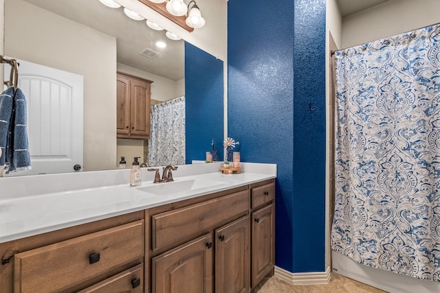 bathroom with vanity and tile patterned floors