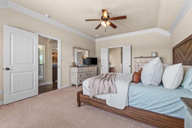 carpeted bedroom with ceiling fan, lofted ceiling, and ornamental molding