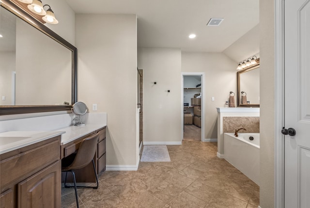 bathroom with vanity, plus walk in shower, and tile patterned floors