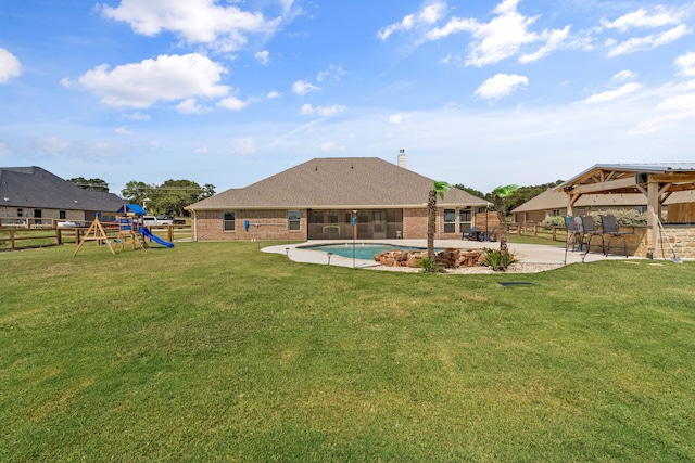 view of yard with a gazebo, a patio area, and a playground