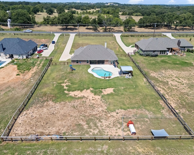 birds eye view of property with a rural view