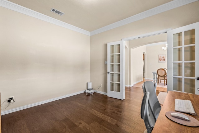 office with dark hardwood / wood-style flooring, a notable chandelier, crown molding, and french doors