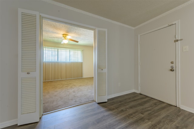 entrance foyer featuring crown molding, hardwood / wood-style floors, and ceiling fan