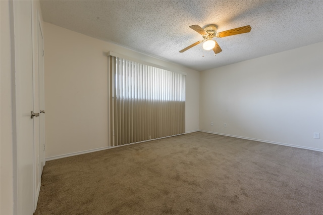 unfurnished room featuring carpet, ceiling fan, and a textured ceiling