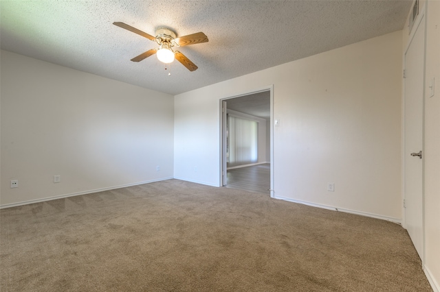 unfurnished room featuring carpet flooring, a textured ceiling, and ceiling fan