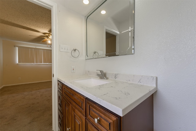 bathroom featuring vanity and ceiling fan