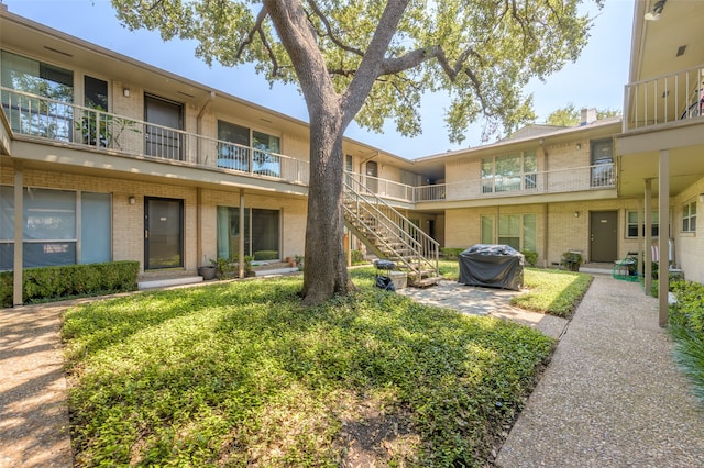 view of property's community with a patio area