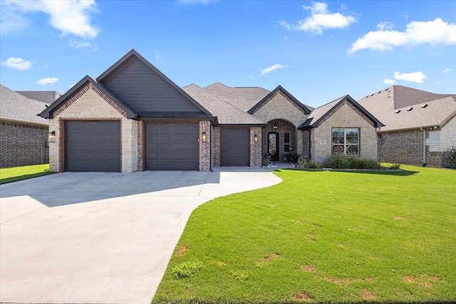 view of front of property with a garage and a front yard