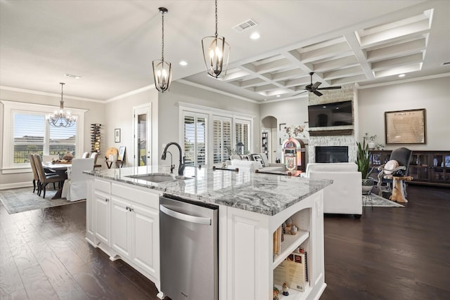 kitchen with sink, white cabinetry, light stone countertops, an island with sink, and stainless steel dishwasher