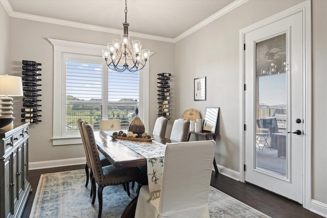 dining room featuring an inviting chandelier, dark hardwood / wood-style flooring, and crown molding