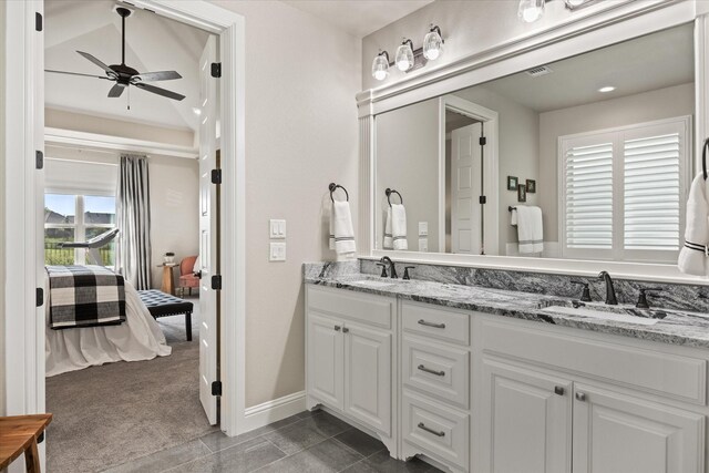 bathroom featuring ceiling fan, tile patterned flooring, and double vanity