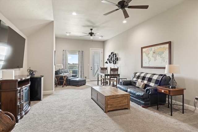 living room with light colored carpet and ceiling fan