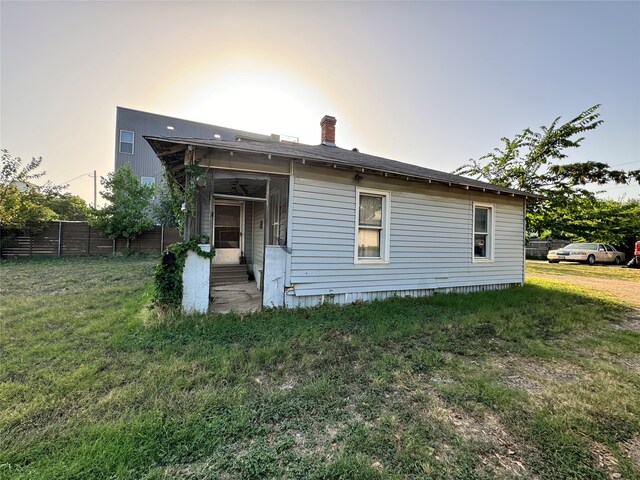 back of house with a yard