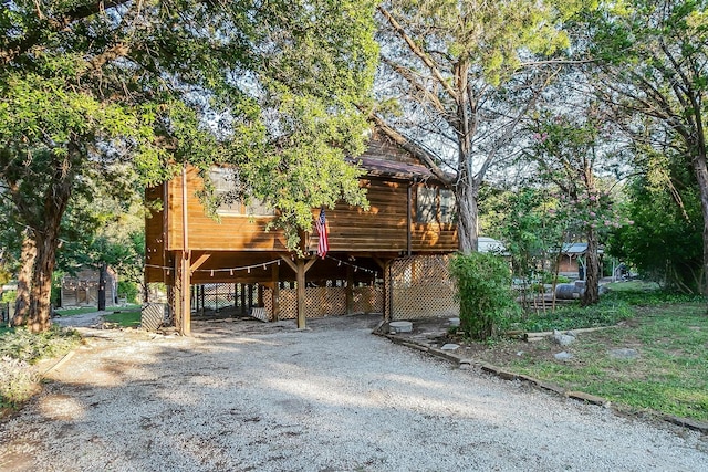 view of front of property featuring a carport