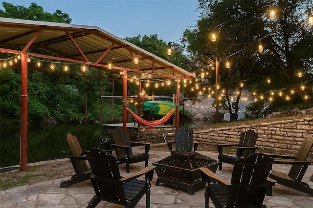 patio terrace at dusk with a fire pit