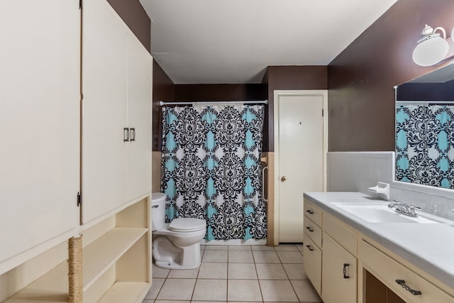 bathroom featuring vanity, toilet, and tile patterned floors