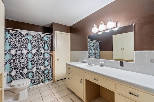 bathroom featuring tile patterned floors, vanity, toilet, and backsplash