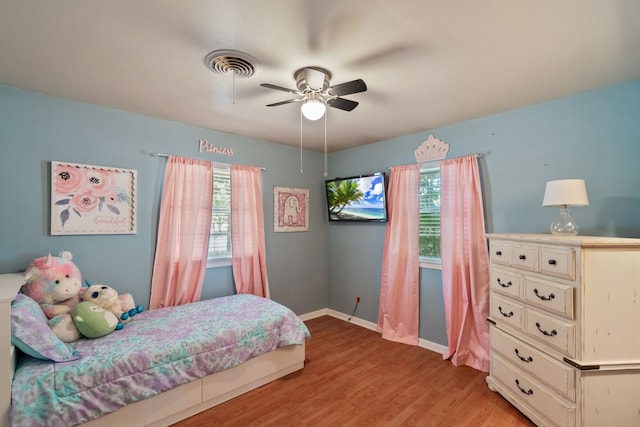 bedroom with ceiling fan and wood-type flooring