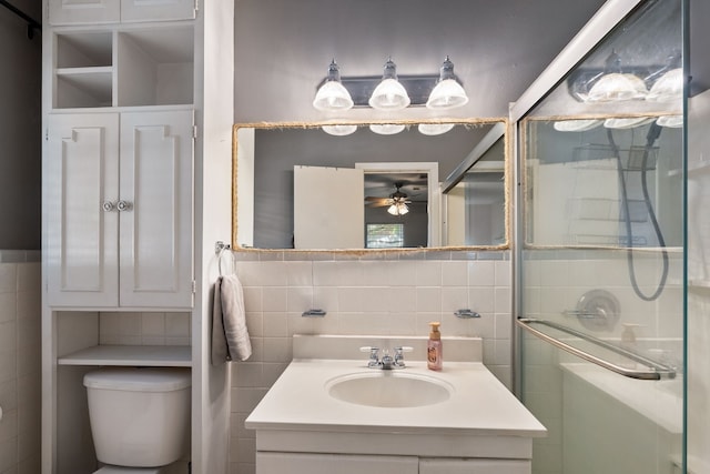 bathroom featuring vanity, backsplash, tile walls, toilet, and ceiling fan