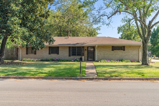 ranch-style home with a front yard