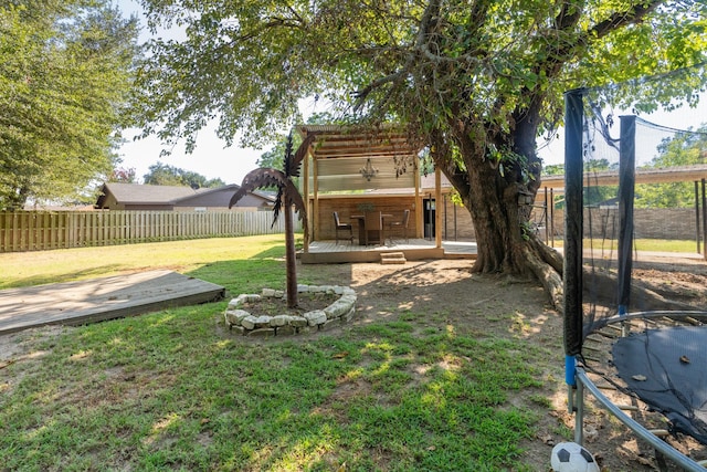 view of yard featuring a deck and a pergola