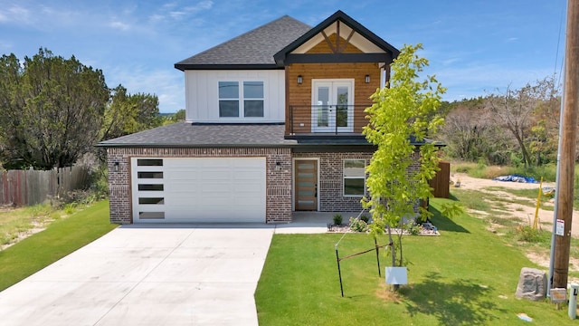 view of front of home featuring a garage and a front yard