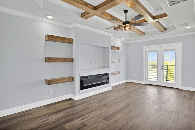 unfurnished living room featuring hardwood / wood-style floors, ceiling fan, coffered ceiling, and ornamental molding