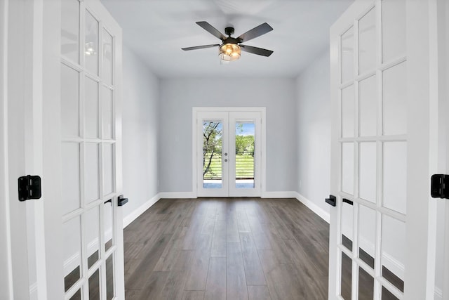 empty room with french doors, ceiling fan, and hardwood / wood-style floors