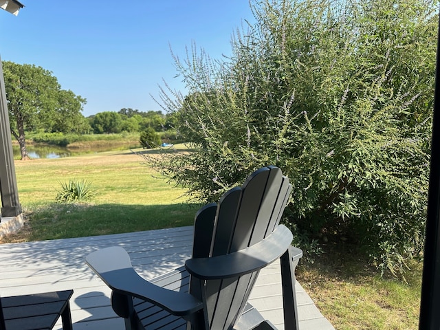 view of patio with a deck with water view