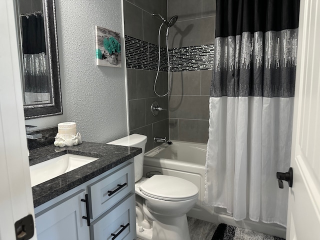 full bathroom featuring vanity, toilet, and shower / bathtub combination with curtain