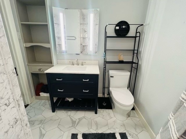 bathroom with tile patterned floors, toilet, and vanity