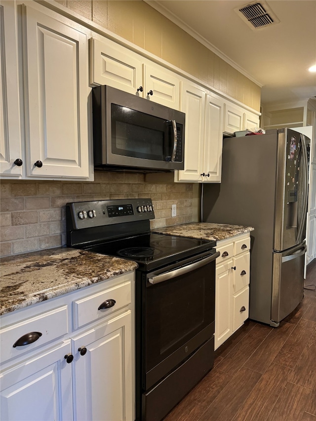 kitchen with stainless steel appliances, white cabinets, backsplash, dark hardwood / wood-style floors, and stone countertops