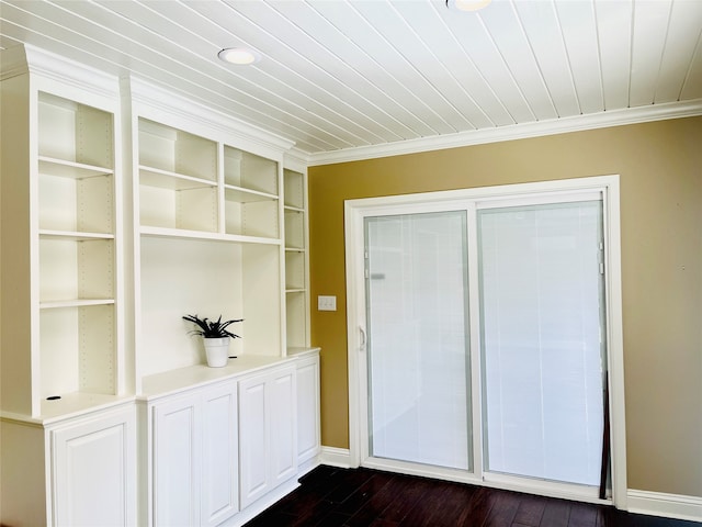 interior space featuring ornamental molding and dark hardwood / wood-style flooring