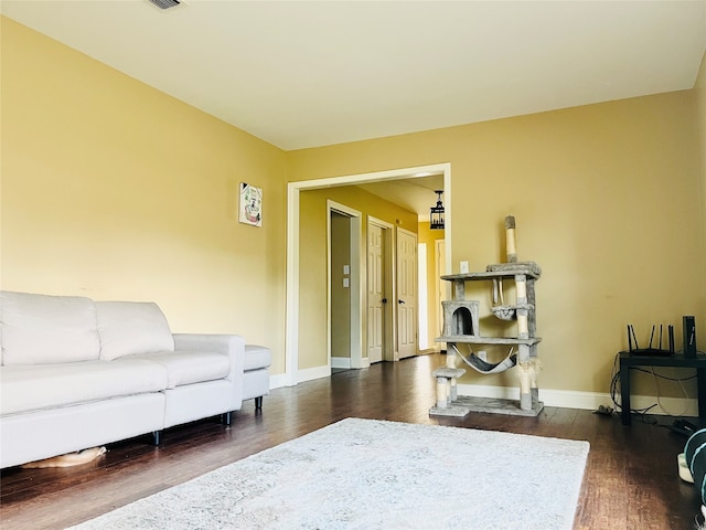 living room with dark hardwood / wood-style floors