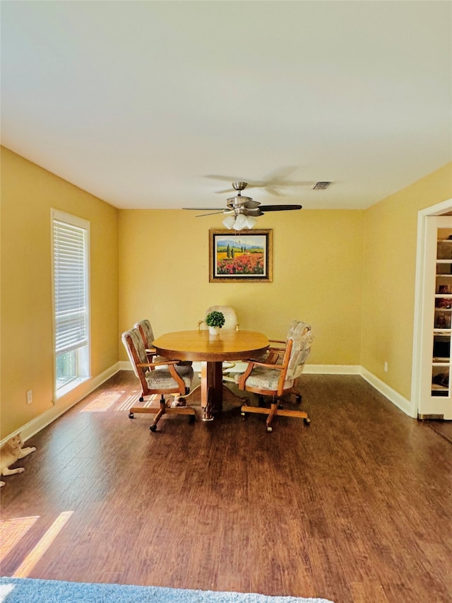 dining space featuring hardwood / wood-style flooring and ceiling fan