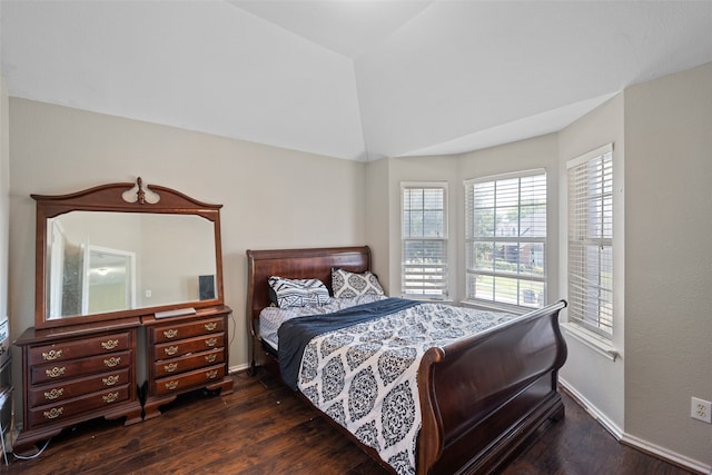 bedroom featuring vaulted ceiling and dark hardwood / wood-style floors