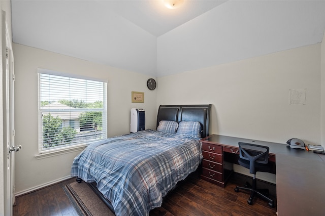 bedroom featuring lofted ceiling and dark wood-type flooring