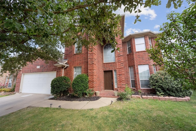 view of front of home with a front lawn and a garage