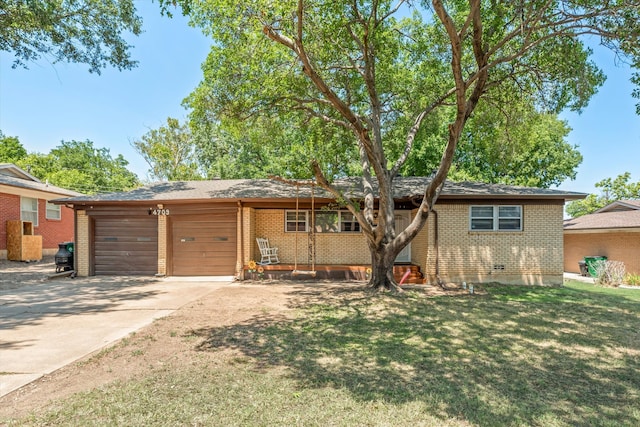 single story home featuring a garage and a front lawn