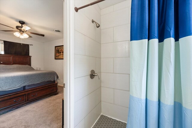 interior space featuring a shower with curtain and ceiling fan