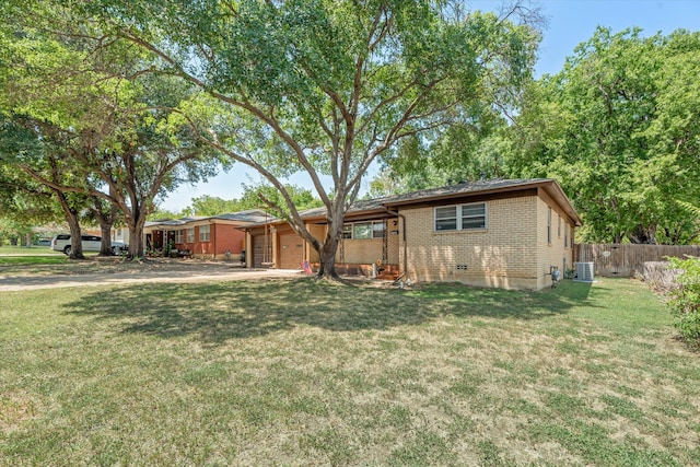 exterior space featuring cooling unit and a yard